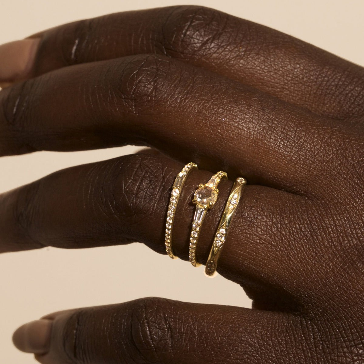 Lamont designer diamond band with baguette and tapering round diamonds in gold