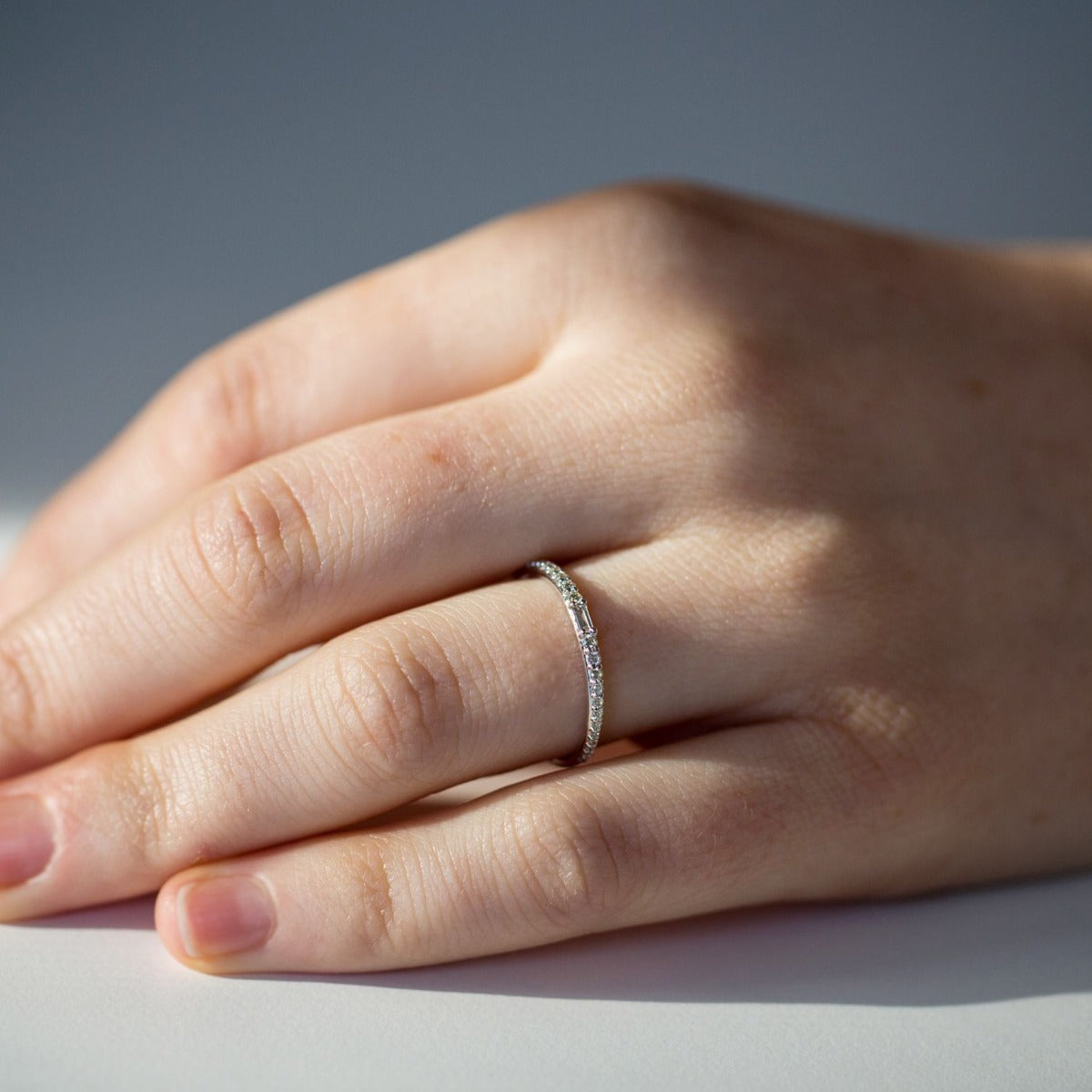 Lamont designer diamond band with baguette and tapering round diamonds in gold